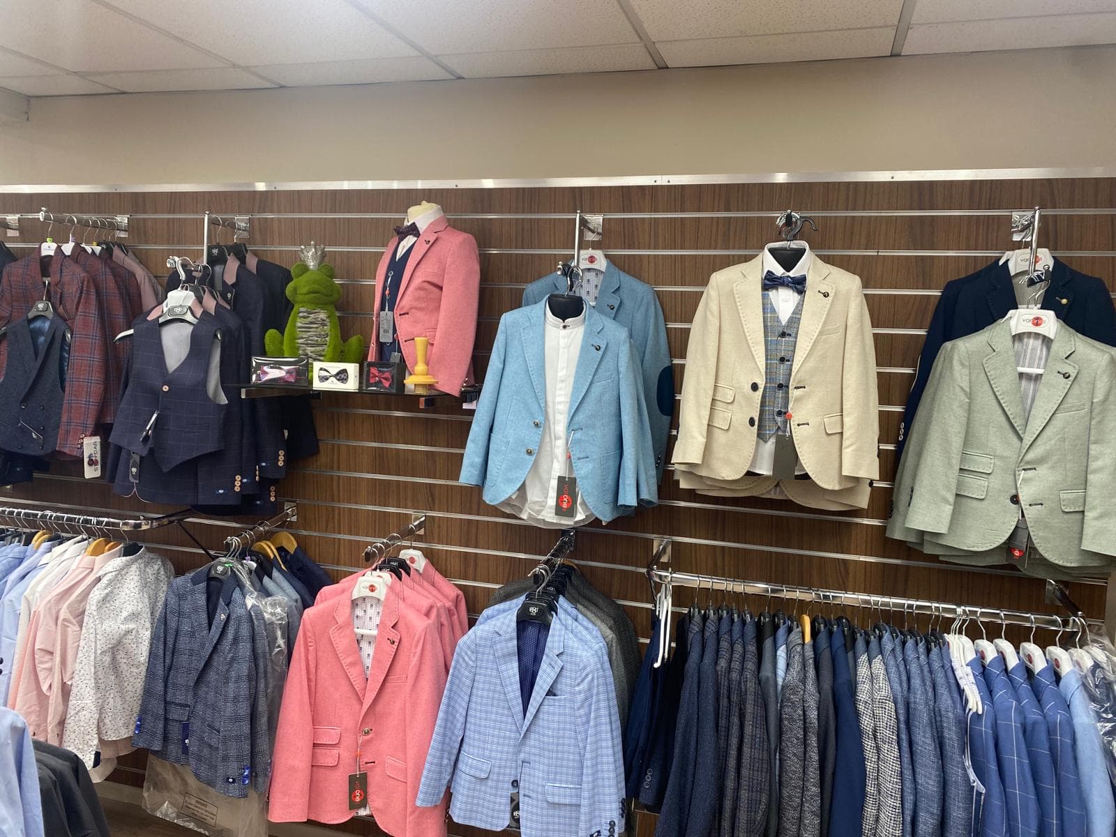 Boys’ formal blazers on the wall